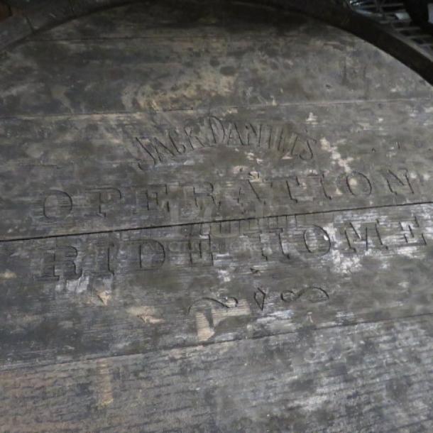 Jack Daniels barrel with "Operation Ride Home" stamped on top; rustic wood finish; collectible item.