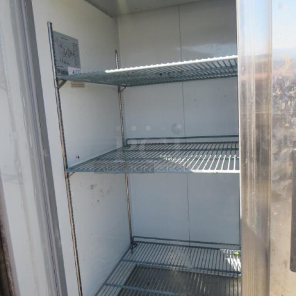 Avantco 2 Door Refrigerator, model 178A49FHC, features 6 racks on casters. Dimensions: 54x32x82.5 inches. Working condition.