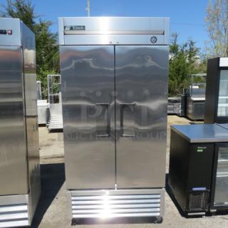 True T-35 two-door refrigerator on casters with four racks. Measures 39.5x30x83.5 inches, 115V. Clean, stainless steel exterior.