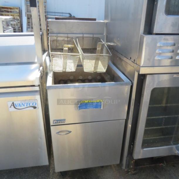 Pitco 65C+ natural gas deep fryer, 65-80lb capacity, includes 2 baskets, on casters, stainless steel, 20x34x48 inches.