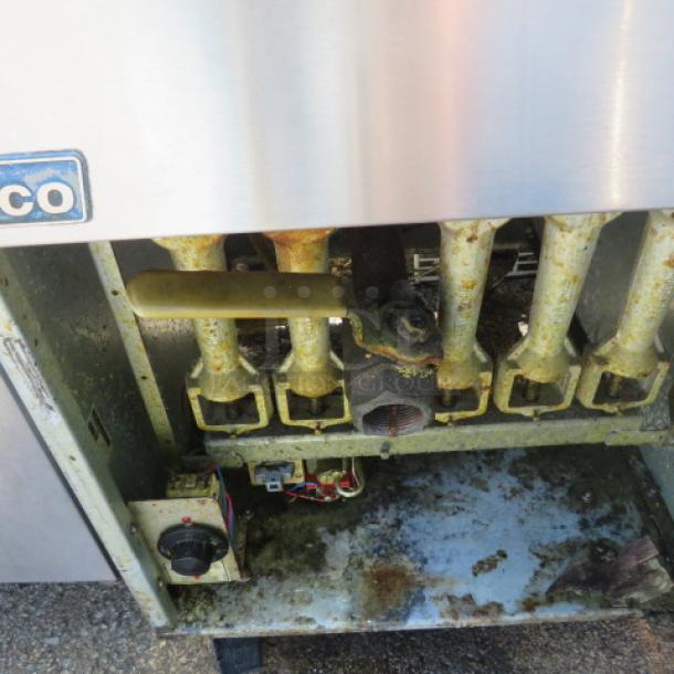 Pitco 65C+ natural gas deep fryer with two baskets on casters, model 65C+, shows visible wear; dimensions 20x34x48 inches.