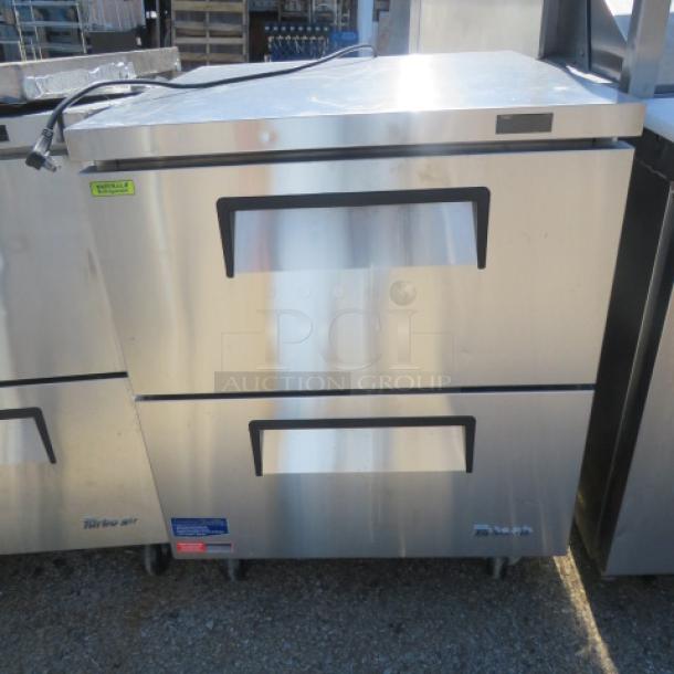 Turbo Air TUF-28SD-D2-N worktop refrigerator, two drawers, stainless steel, on casters. Dimensions: 27.5x30x36 inches.