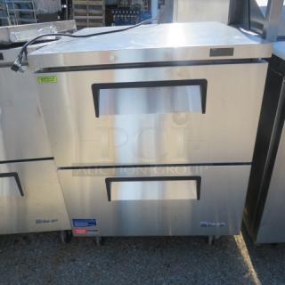 Turbo Air TUF-28SD-D2-N worktop refrigerator, two drawers, stainless steel, on casters. Dimensions: 27.5x30x36 inches.