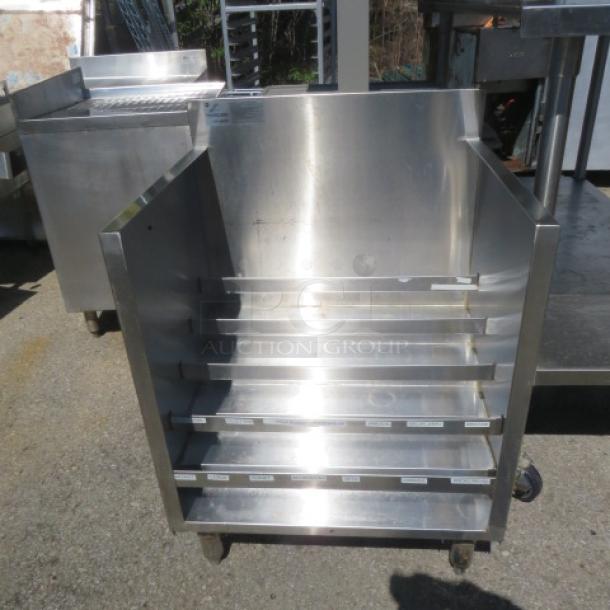 Advance Tabco SS Tiered Under Bar Liquor Display, Model CRLR-24, stainless steel, 24x21x33, on wheels, excellent condition.