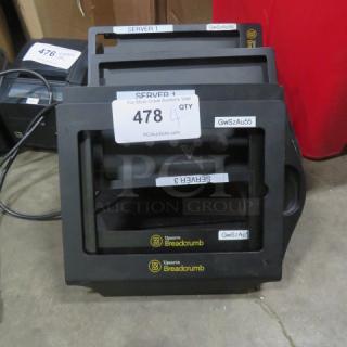 Stack of four IPAD stand holders, model 4XBID, featuring Breadcrumb branding and server labels. Tags indicate item 478 for auction.