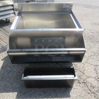 Krowne stainless steel ice well with attached bottle rail, 24x24x35 inches, high-quality condition, model label visible.