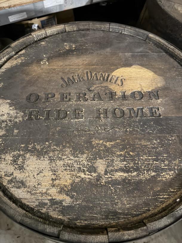 Jack Daniels barrel with "Operation Ride Home" stamp. Rustic condition; unique collector's item.