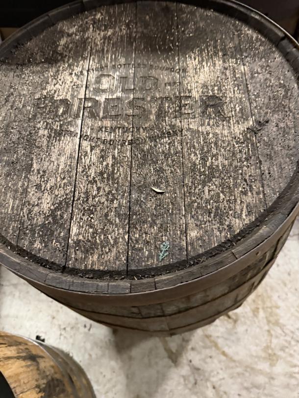 Old Forester Whiskey Barrel, aged wood, embossed logo, used condition, standard size, ideal for collectors or decor.