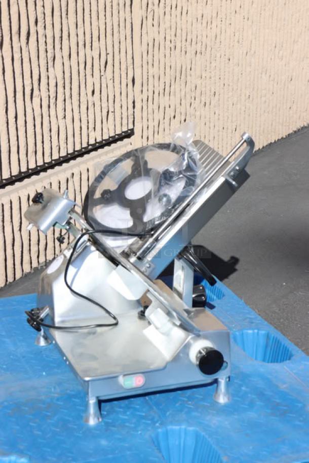 Brand new Avantco SL713MAN 13" medium-duty meat slicer, 3/4 hp, 120V, scratch-n-dent condition, with protective cover.