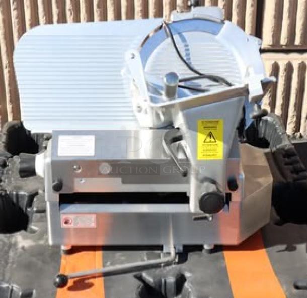 Brand new Estella SLA13 13" automatic meat slicer, 3/4 hp, 120V. Scratch-n-dent condition with manual use option.