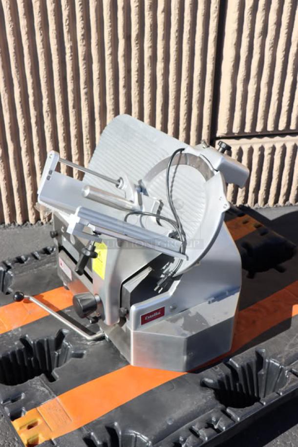 Estella SLA13 13" heavy-duty automatic meat slicer, brand new with scratch-n-dent. 3/4 hp motor, manual option.