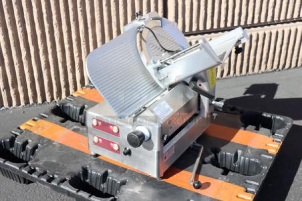 Brand new Estella SLA13 13" heavy-duty automatic meat slicer, 3/4 hp, 120V, with manual option. Scratch-n-dent condition. S/N: 20BEJA0667.