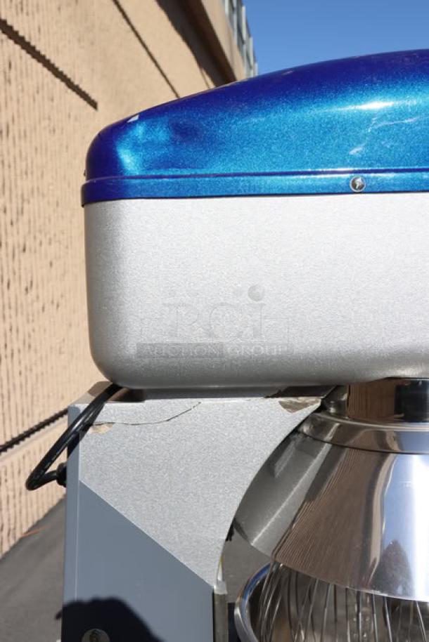 Brand new Vollrath 40757 20 Qt. planetary stand mixer with guard; metallic finish, slight cosmetic scratch visible.