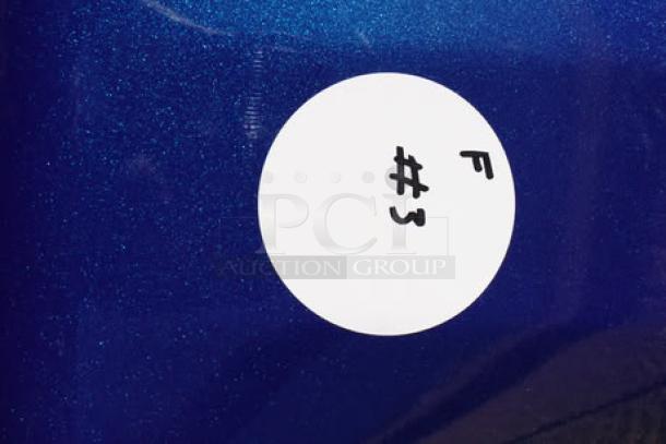Circle label on blue surface, marked with "F #3" in black ink.