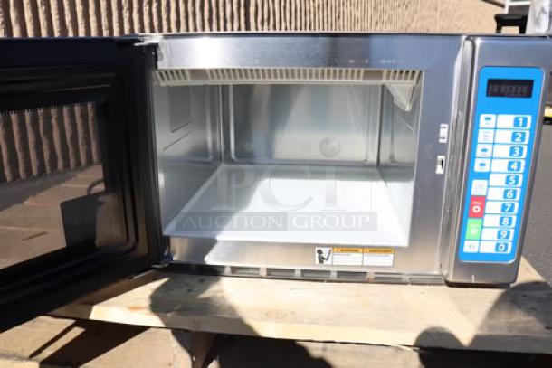 Brand new Solwave Ameri-Series SWA12T commercial microwave, 1,200W, stainless steel, push button controls, superficial dents visible.