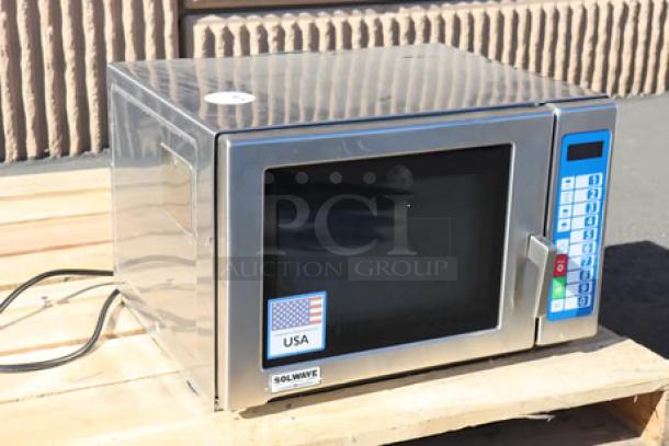 Brand new Solwave Ameri-Series SWA12T stainless steel microwave, 1200W, with push button controls. Superficial denting visible.