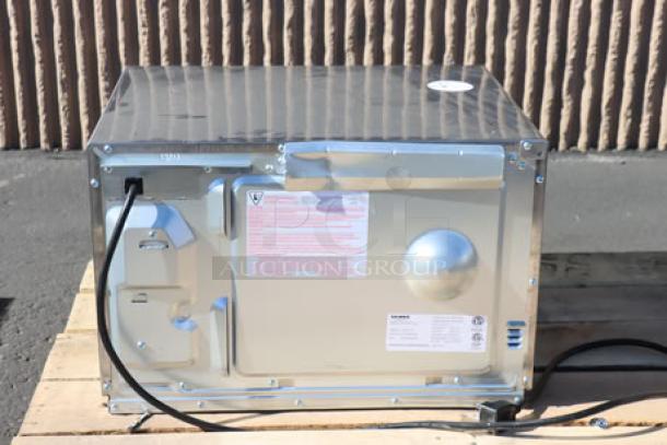 BRAND NEW Solwave Ameri-Series SWA12T stainless steel commercial microwave, 1200W, with push-button controls; superficial dents visible.