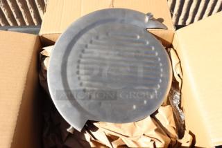Brand new meat slicer component with minor scratches, visible in open box. Circular metal part with ridged surface.