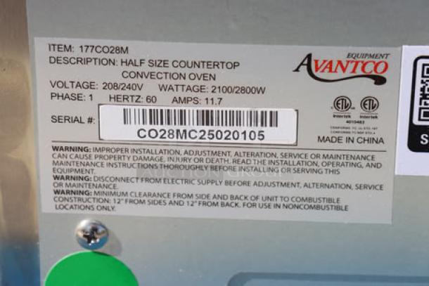 Avantco CO-28M countertop convection oven label showing model, voltage, wattage, and serial number CO28MC25020105.