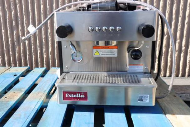 Brand new Estella Caffe ECEM1C one group compact automatic espresso machine, 110V, stainless steel, visible buttons and label.