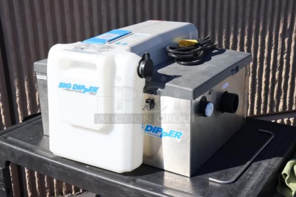 Brand new Thermaco Big Dipper W-200-IS 47 lb. automatic grease trap, 115v, scratch-n-dent condition, visible controls, and labeling.