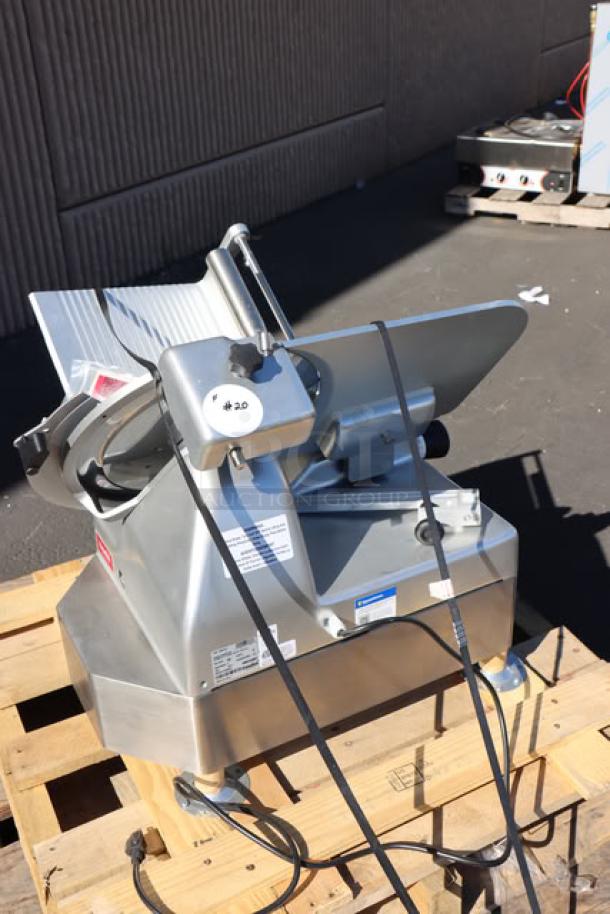 Brand new Estella SLA13 13" automatic meat slicer, heavy-duty, with manual option, 3/4 hp, 120V, minor scratches.