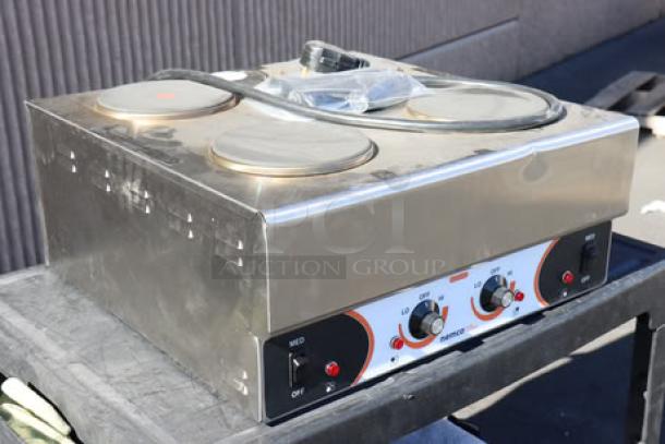 Nemco 6311-4-240 Electric Countertop Raised Hot Plate, 4 solid burners, superficial denting, serial number 25090814.