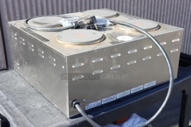 Nemco 6311-4-240 Electric Countertop Raised Hot Plate, 4 Solid Burners, superficial denting, S/N: 25090814, 240V.