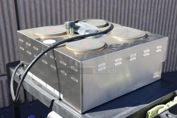 Alt text: Nemco 6311-4-240 electric countertop hot plate with four solid burners, 240V, slight denting, brand new without box.