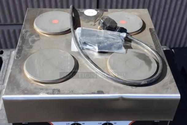 Nemco 6311-4-240 electric countertop hot plate with 4 solid burners. Brand new, superficial denting. Serial: 25090814.