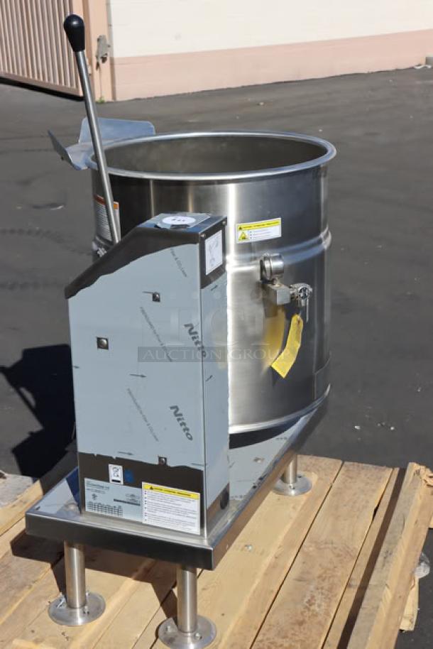 Brand new Cleveland KET-20-T 20-gallon electric kettle, stainless steel, tilting feature, 208/240V, model and safety labels visible.