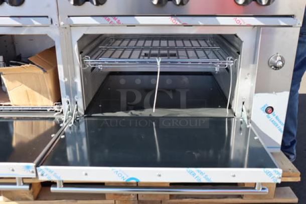 Brand new Wolf by Vulcan natural gas range, model C60SS-10BN, with 10 burners, 2 ovens; dented and scratched riser.