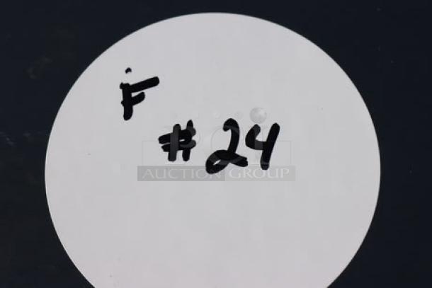 White circle tag marked with “F #24” in black handwriting.
