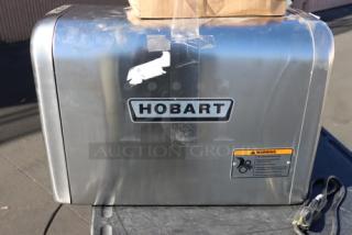 Hobart 4822-35 #22 meat grinder, scratched and dented, includes leg set. Serial number: 31-1686-624, warning label visible.