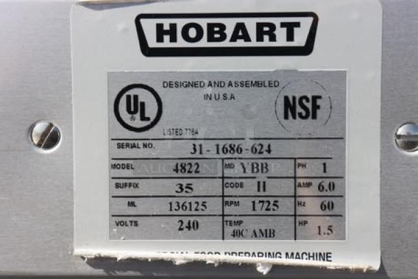 Hobart 4822-35 meat grinder serial number plate, showing model, volts, amps, and HP info, scratched and dented.