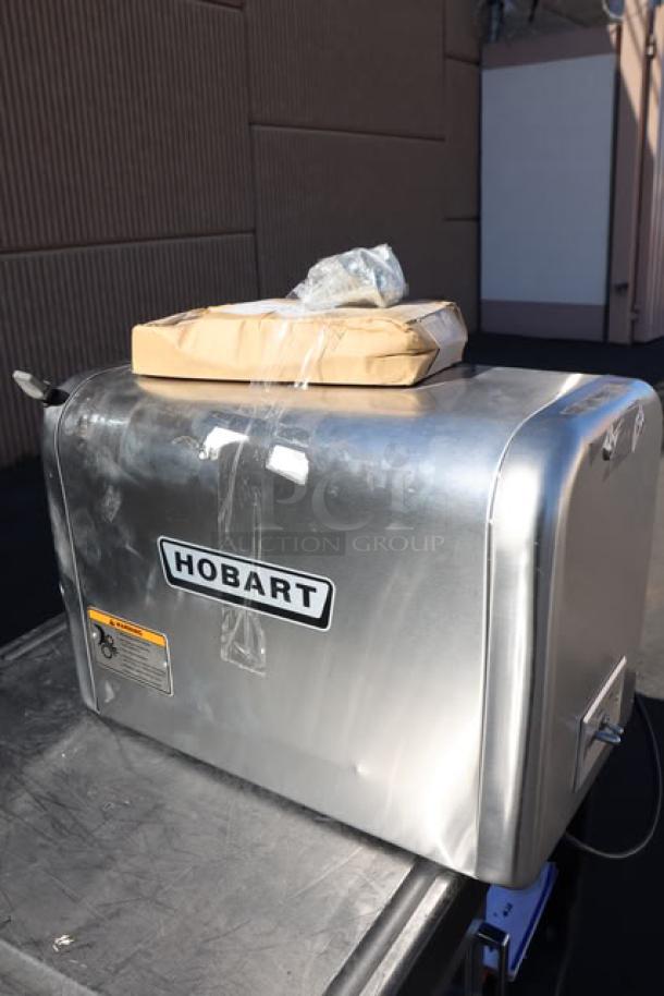 Hobart 4822-35 meat grinder, scratched and dented, includes leg set; out of packaging. Visible serial number: 31-1686-624.