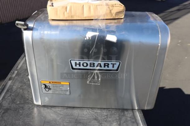 Hobart 4822-35 meat grinder, scratched and dented, with label and warning sticker, includes leg set.