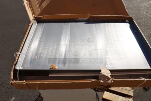 Brand new Assure Parts 6 burner griddle top, model 177AOGT3627, with damaged original packaging, size 35 7/8"x27"x4".