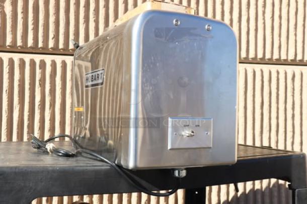 Brand new Hobart 4822-35 #22 Meat Grinder in stainless steel. Features on/off switch. Serial number 31-1686-625.