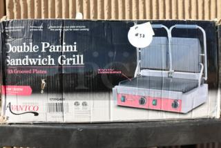 Brand new Avantco PG400 Dual Panini Grill, grooved plates, 19 5/8" x 9 1/8" surface, 120V, 3500W, original packaging damaged.