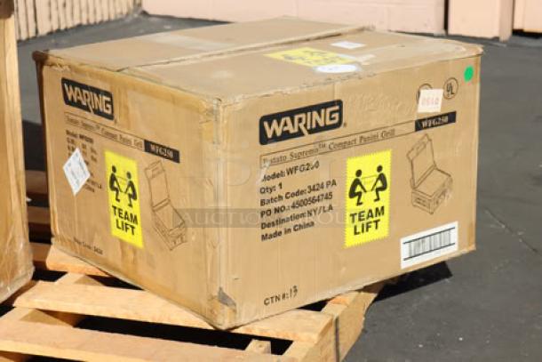 BRAND NEW Waring WFG250 Panini Grill in box; Italian-style, 14.5"x11" surface, 120V, 1800W, smooth top & bottom. Model details visible.