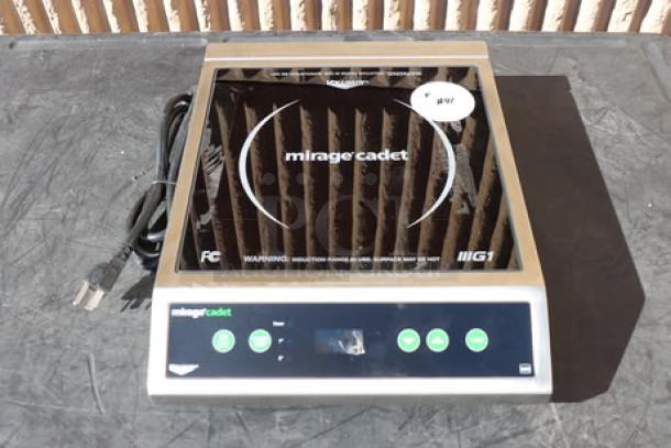 Brand new Vollrath Mirage Cadet countertop induction range, model 59300, 1800W, 120V. Features digital controls, serial number visible.