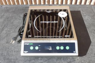 Brand new Vollrath Mirage Cadet countertop induction range, model 59300, 1800W, 120V. Features digital controls, serial number visible.