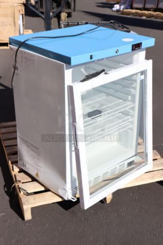 Brand new Summit Appliance ACR52GNSF456 medical refrigerator, glass door, 3.88 cu. ft., blue top, temperature-monitored.