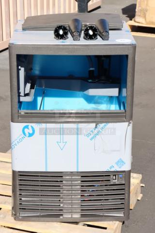 Brand new Manitowoc UDE0065A-161B ice machine, scratch-n-dent, with 31 lb. bin, 57 lb. capacity, air-cooled, 115V, serial 1121289586.