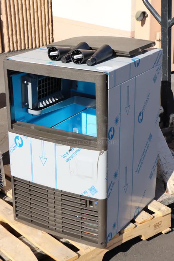 Brand new Manitowoc UDE0065A-161B ice machine, air-cooled undercounter design, dice cube, 31 lb. bin, 57 lb. daily capacity.