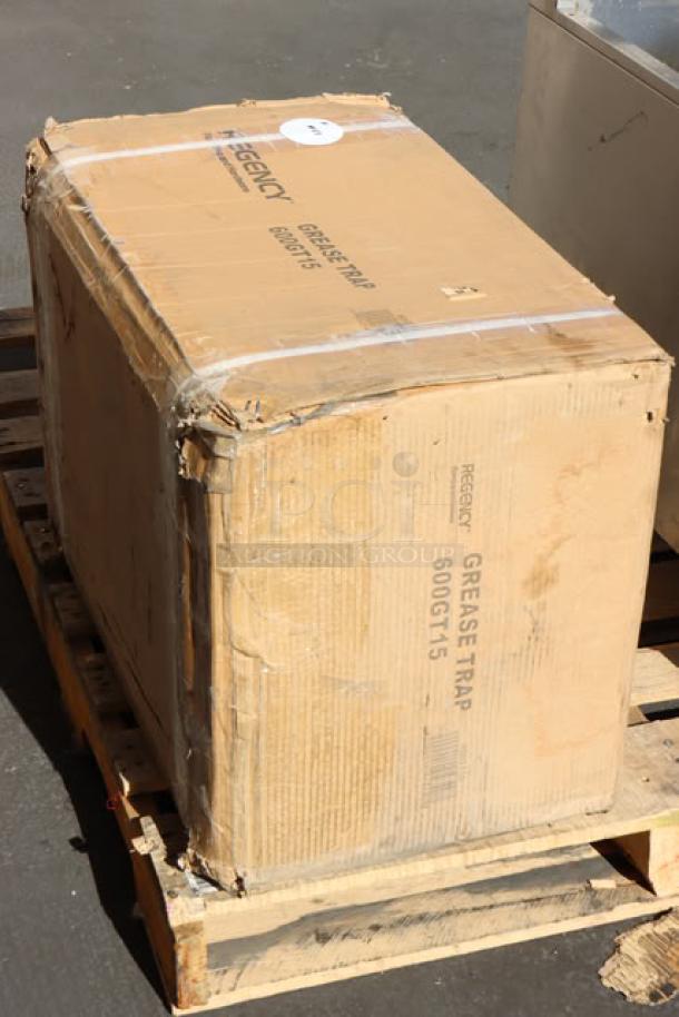 Brand new Regency 600GT15 grease trap, 15 GPM, 30 lb. capacity, non-threaded connections, minor packaging damage.