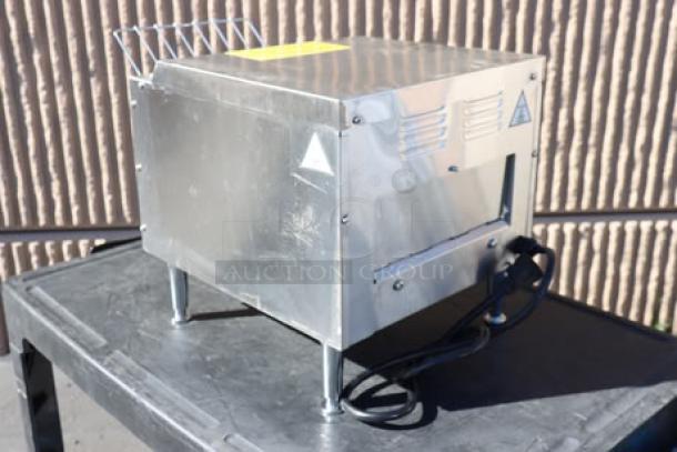 Brand new Avantco T3300B conveyor toaster, 10" wide, 3" opening, 208V, 3300W, 800 slices/hour, minor scratches.