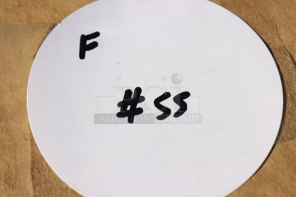 White round label with handwritten text "F #55."