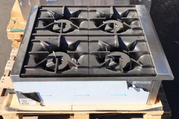 Brand new Avantco CAG-R-4-24 countertop range, 4 burners, 100,000 BTU, minor scratches, possibly missing small parts.